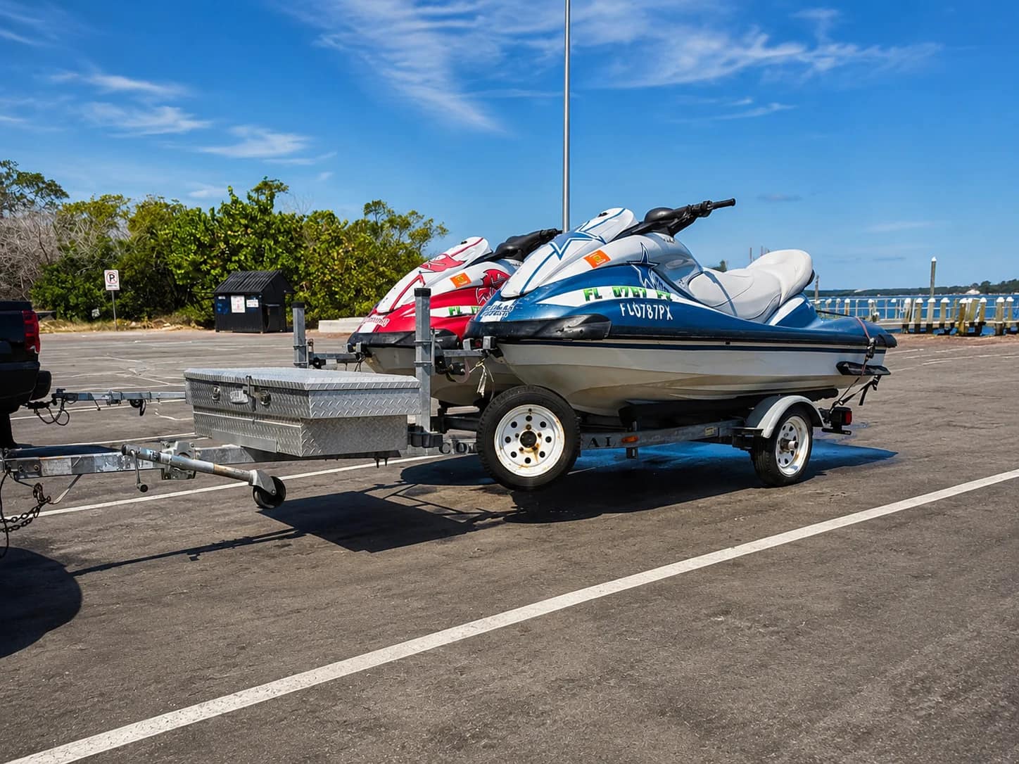 Ocean Fast Rental jet skis lined up at the coastal lot
